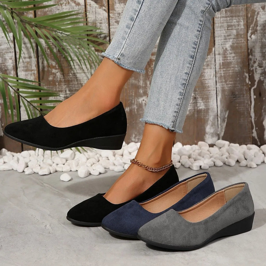 Women's plus size low wedge pumps in Gommino style with pointed toe and suede upper.