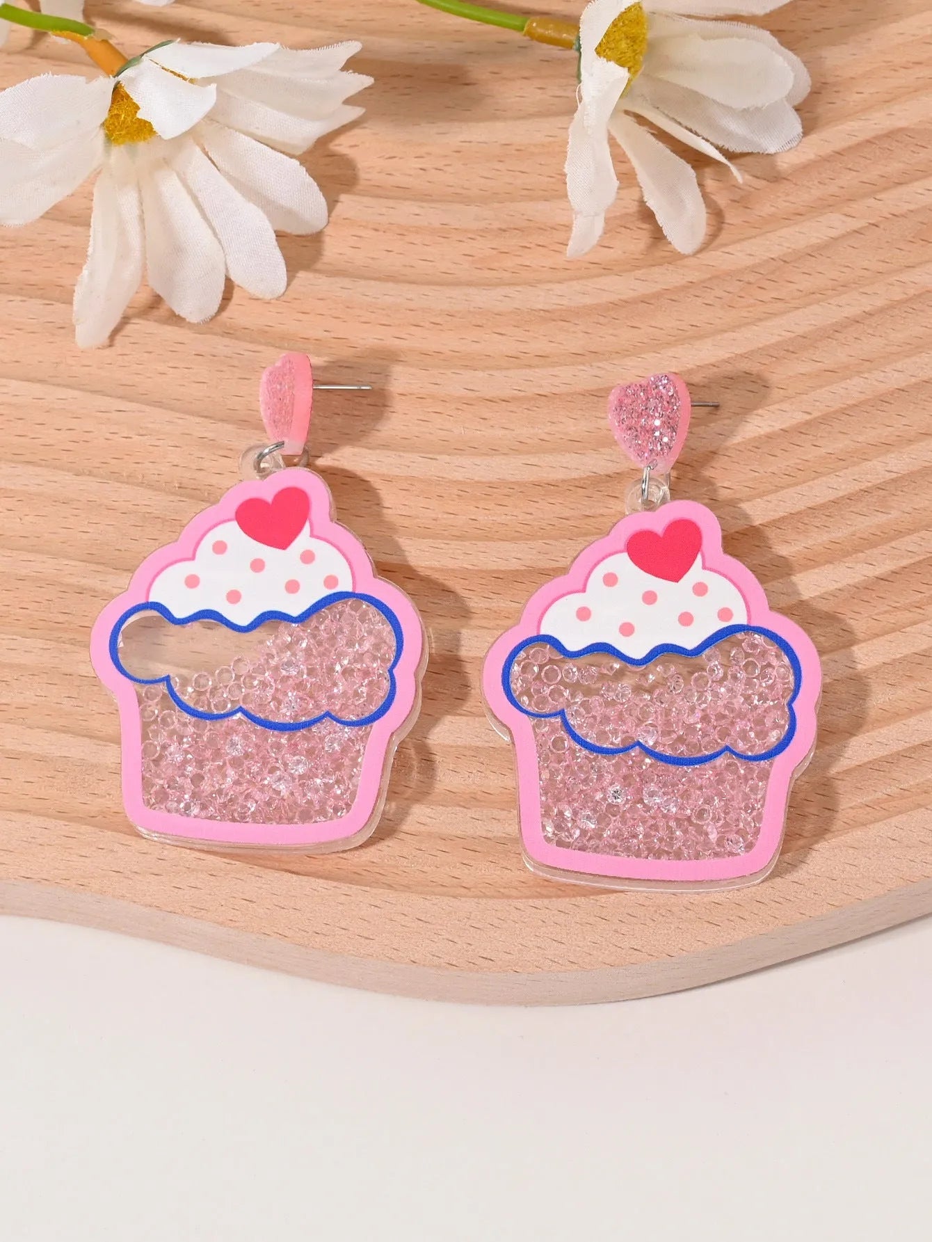 Colourful acrylic fruit and ice cream dangle earrings for women on a white background.