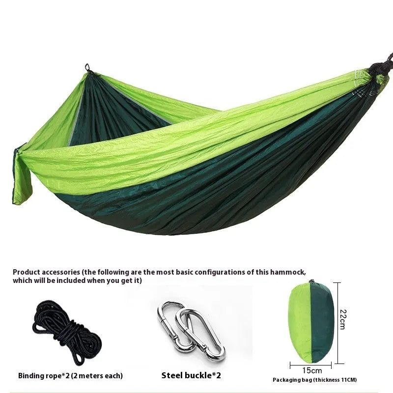 Double camping hammock with ropes and buckles shown in outdoor setting