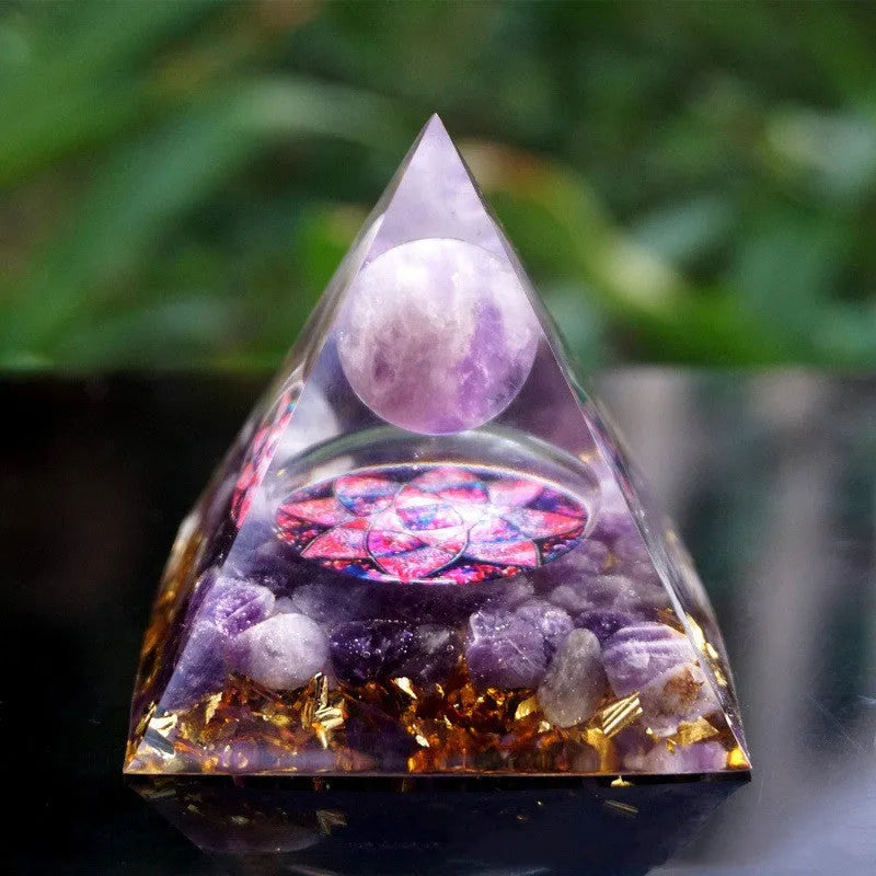 Clear epoxy resin pyramid ornament with embedded coloured crystal gravel inside, measuring 6cm.