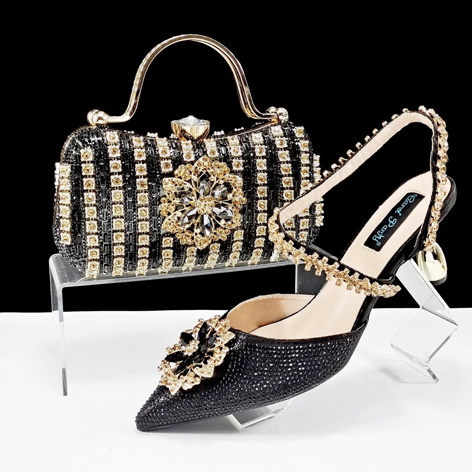 Women's high heel shoes with matching clutch bag featuring decorative flower buckle and ankle chain detail