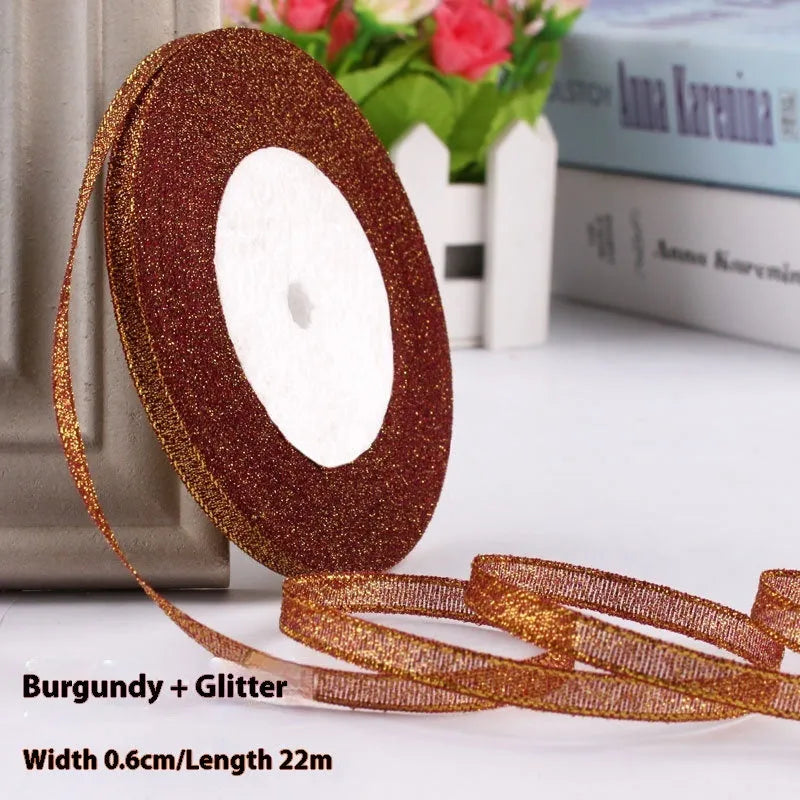 Roll of 0.6cm wide coloured polyester gift ribbon with 22 metre length.