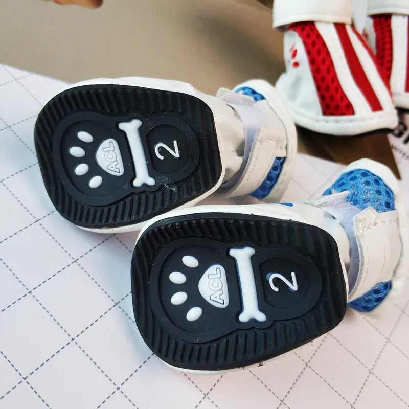Blue zipper-closure dog shoes with non-slip soles from four-piece pet sneaker pack