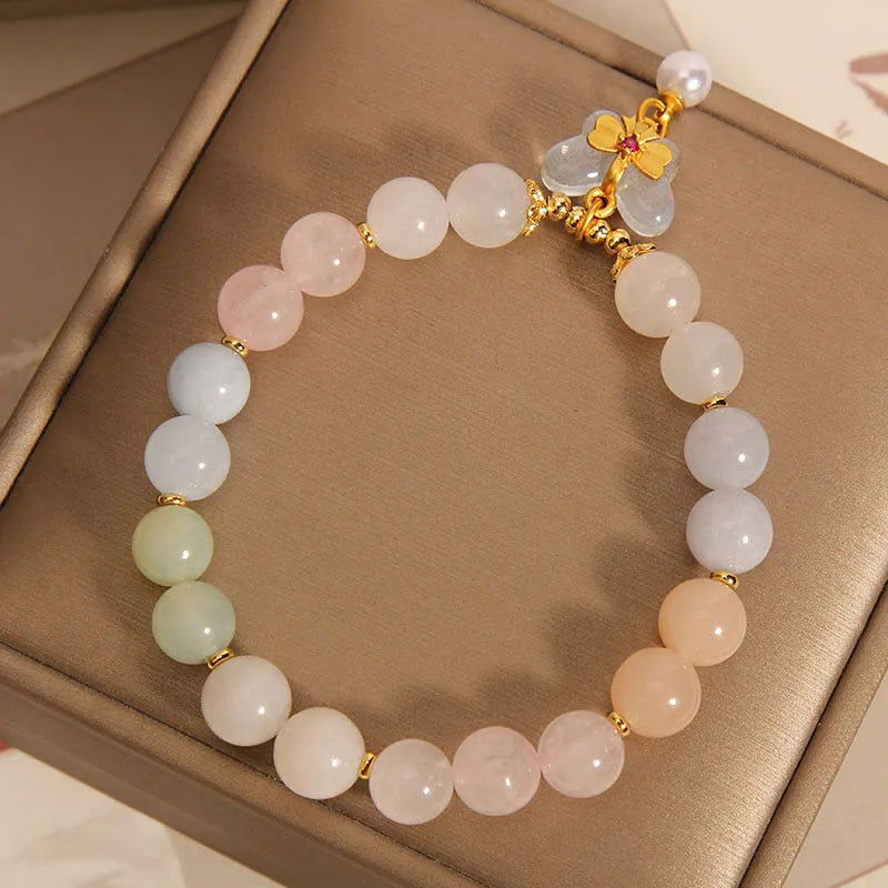 Crystal bracelet with natural Morganite butterfly pendant charm in candy colours on adjustable band