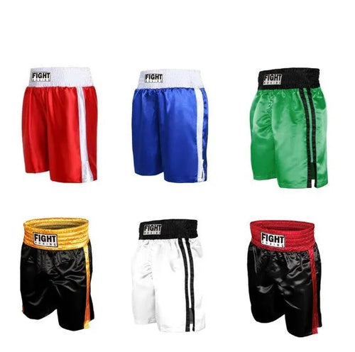 Man wearing black and white striped elastic waist kickboxing shorts in a training stance.