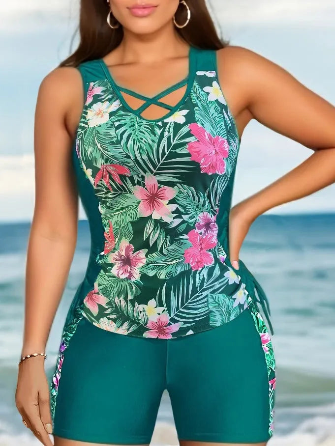 Plus size women wearing a floral printed high-waisted bikini in navy blue