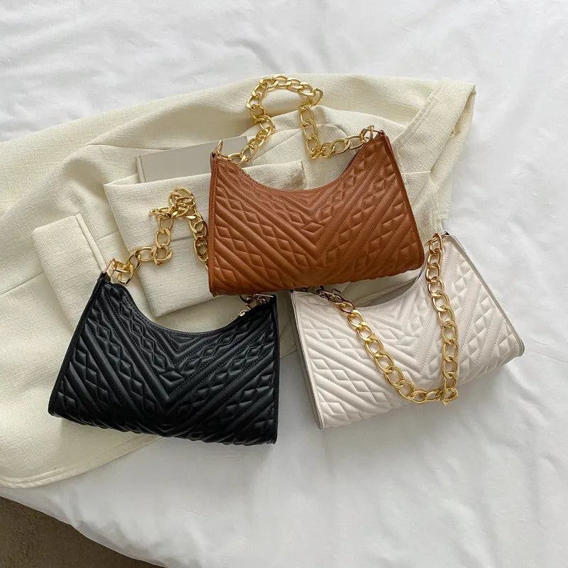 Soft PU leather pleated chain baguette shoulder bag in a vertical square shape, shown in brown colour.