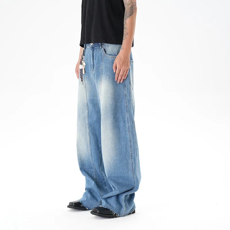 Light blue vintage wash wide leg denim jeans on a model, showing the relaxed fit and zip fly.