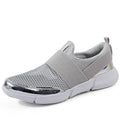 Blue, black, and grey women's low-top sneakers with a mesh lining and lightweight design.