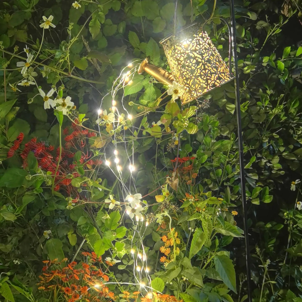 Solar-powered butterfly kettle garden light with wrought iron construction and solar panel