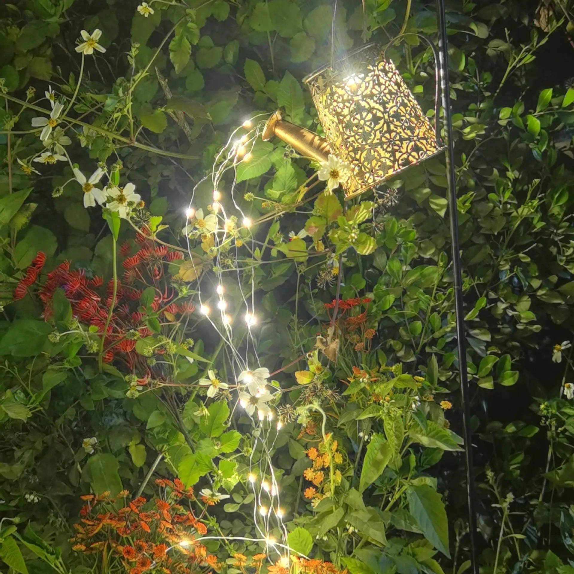 Solar-powered butterfly kettle garden light with wrought iron construction and solar panel