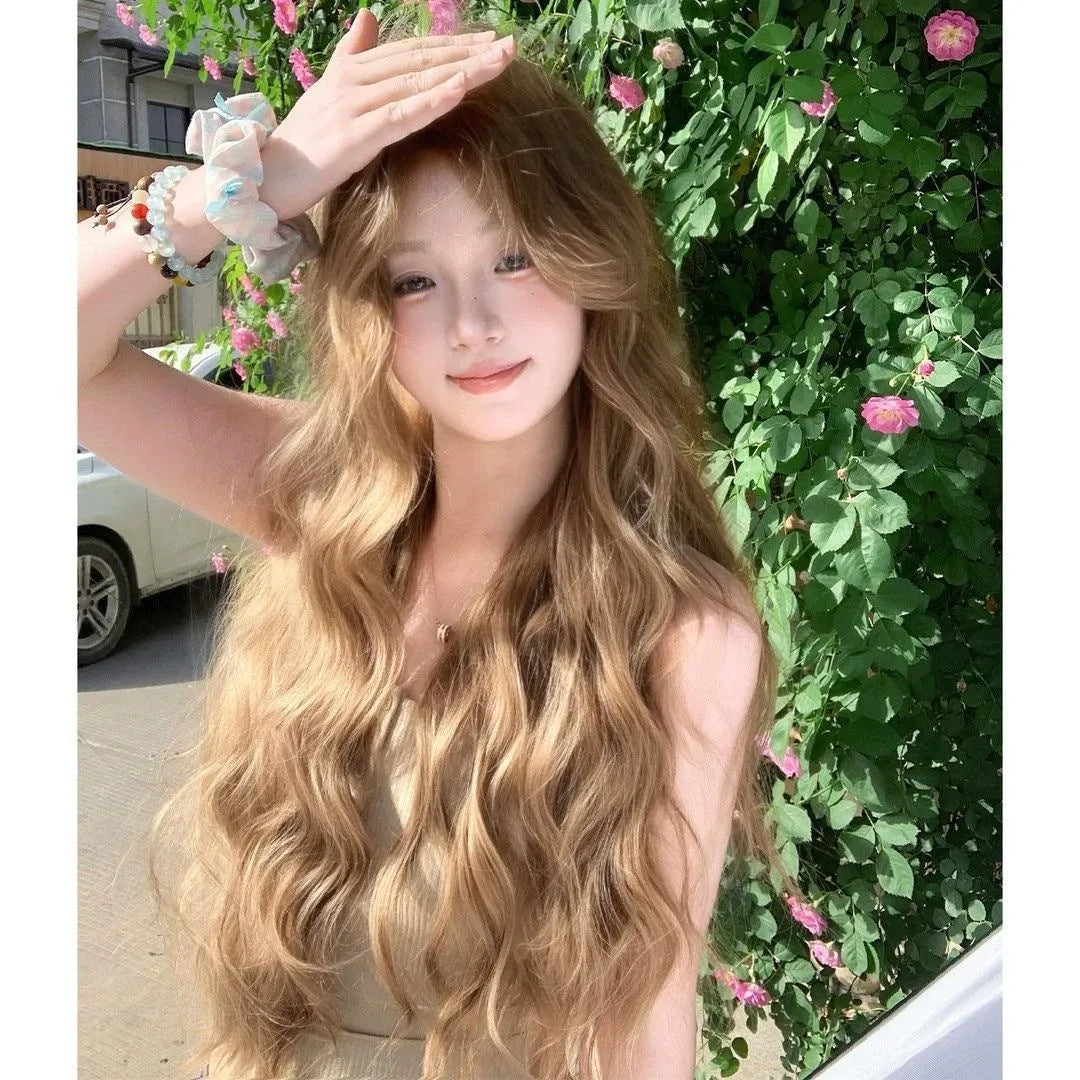 Brown synthetic curly wig of medium length with an attached hair net.
