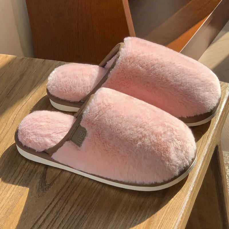 Winter plush slippers in solid colours with non-slip PVC soles and car stitching detail