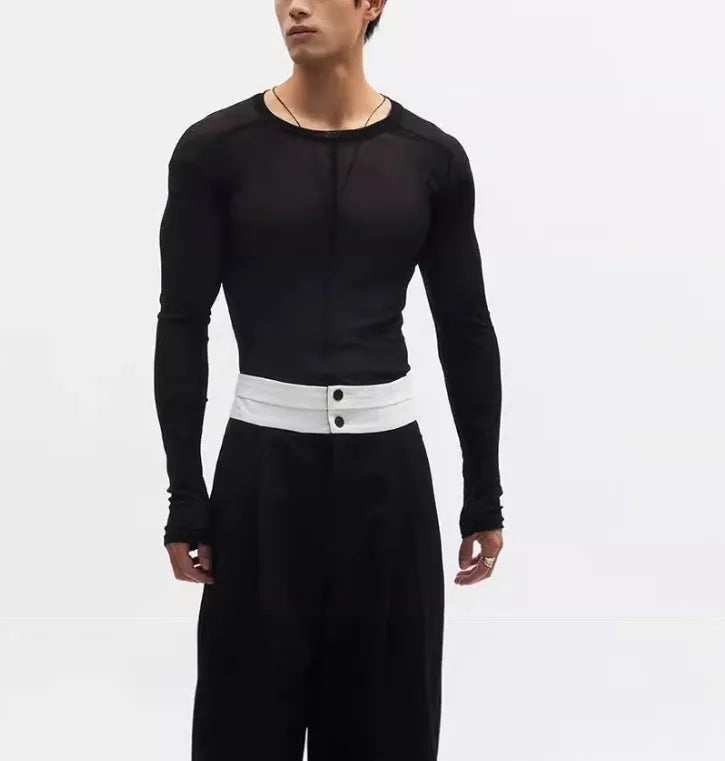 Black women's slim-fit pullover with mesh see-through texture and long sleeves.