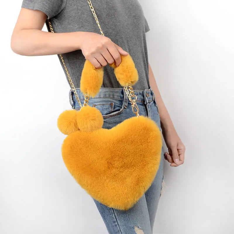 Soft plush heart-shaped women's handbag in medium size with zipper closure