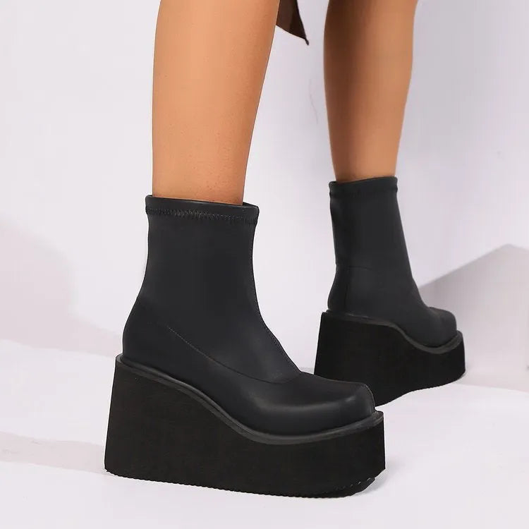 Plus size women's wedge heel boots with waterproof platform sole in black leather