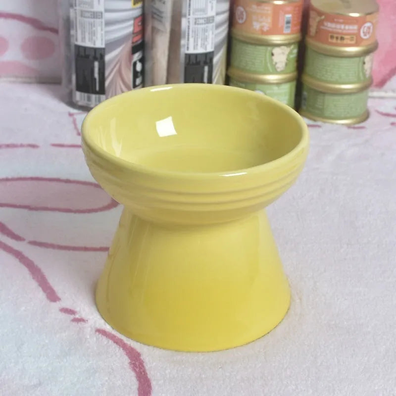 Black ceramic pet bowl with high foot and raised neck for dog or cat feeding