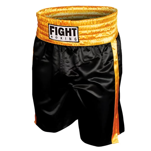 Man wearing black and white striped elastic waist kickboxing shorts in a training stance.