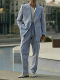 Blue and white striped polyester two-piece suit set with blazer and trousers on a hanger.