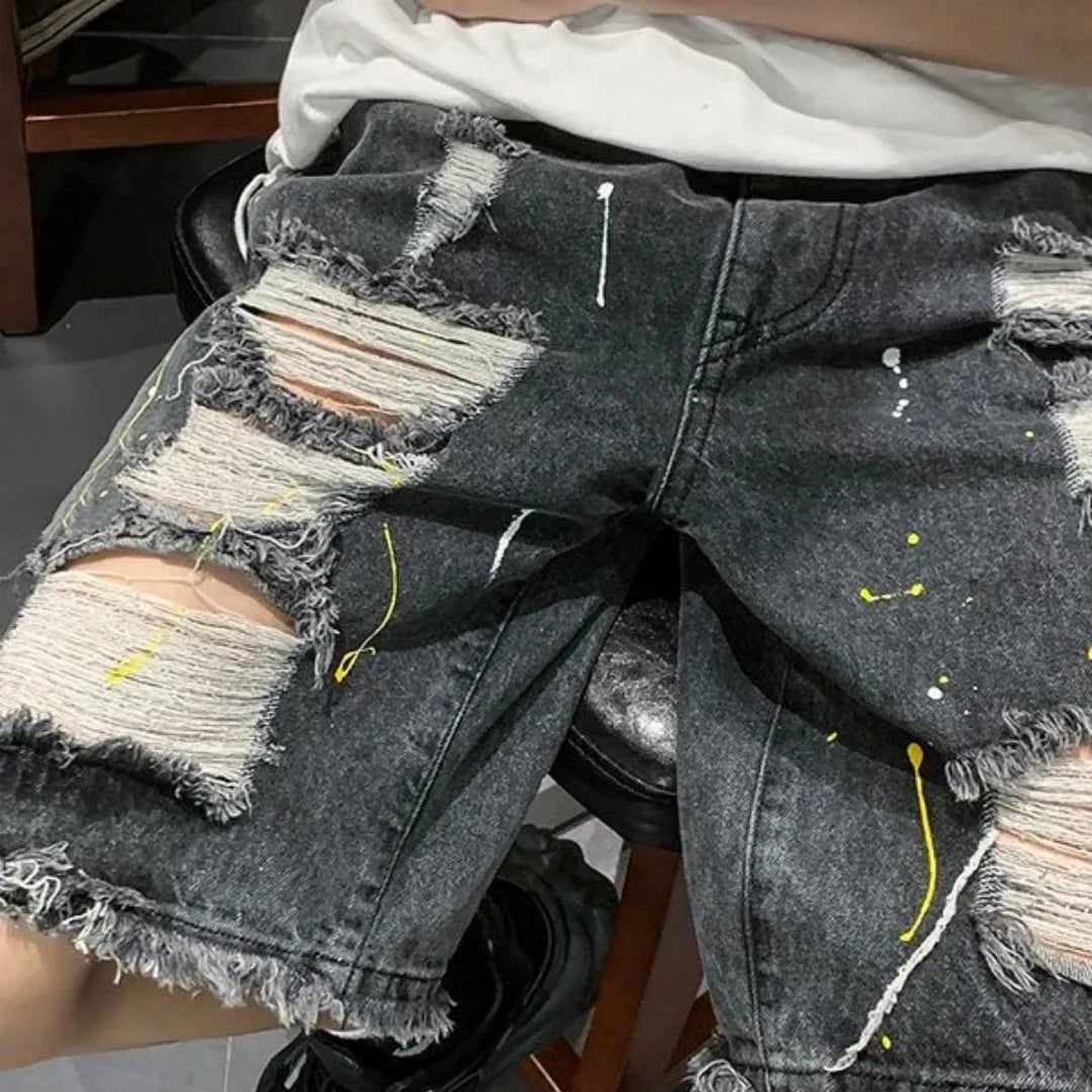 Men's black and light blue loose-fit water-washed denim shorts on a size chart.