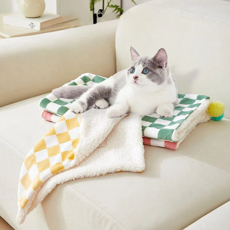 Plaid pattern pet blanket with fur ball decorations in green, pink or yellow colours