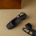 Women's black woven sandals with a chunky 4cm heel, closed square toe, and an ankle strap with a buckle.