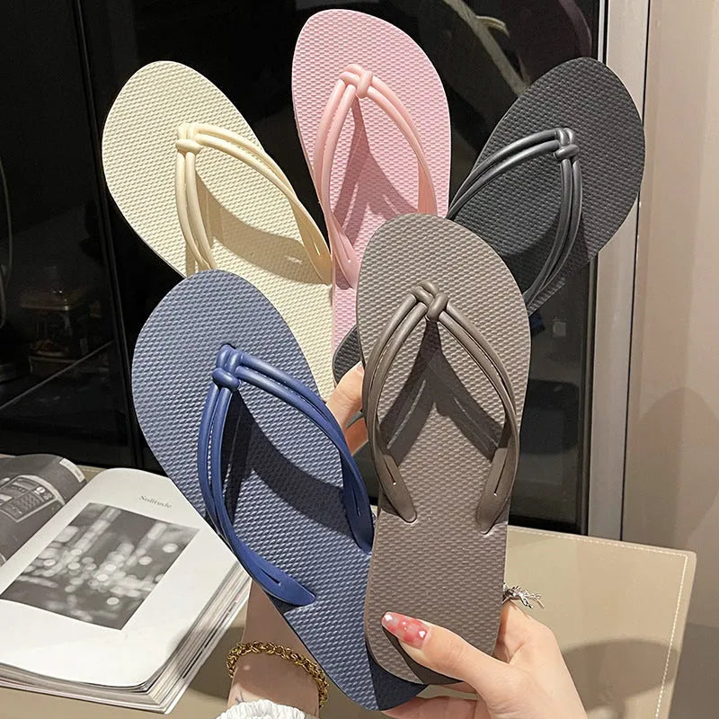 Women's PVC flip flops with toe-covering style and non-slip sole in multiple colours.