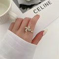 Copper spinning windmill ring with geometric shape, shown in gold and silver colour options.