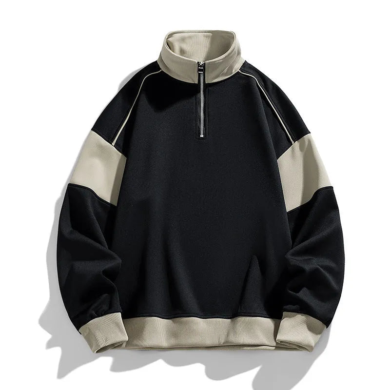 Man wearing a beige corduroy drop shoulder hoodie with loose lapels.