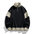 Man wearing a beige corduroy drop shoulder hoodie with loose lapels.