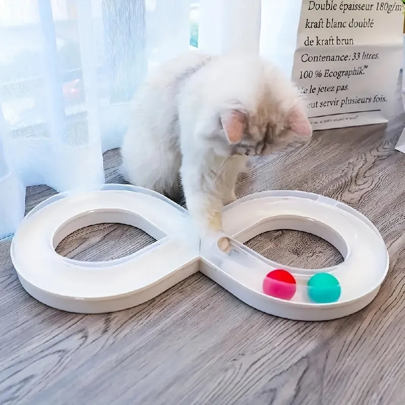 Rotating cat track toy with rolling balls and teasing stick on blue background