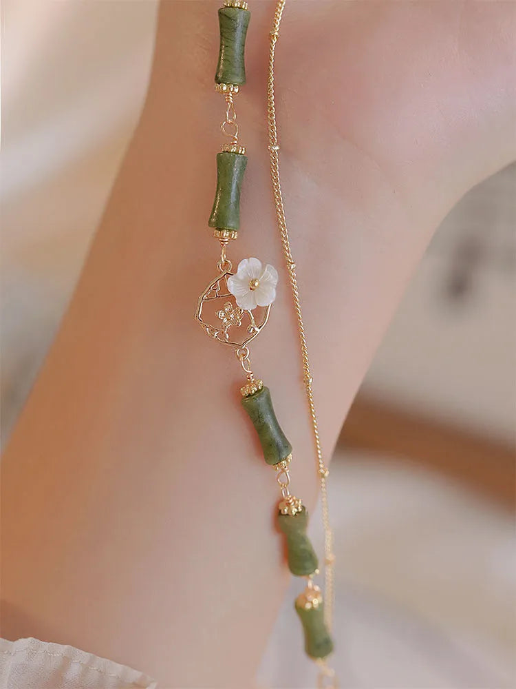 Natural olivine bracelet with double layer twin bells of Ireland design and olive branch elements