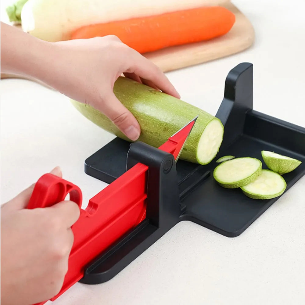 Green and red modern vegetable cutter with stainless steel blades for slicing carrots and potatoes.