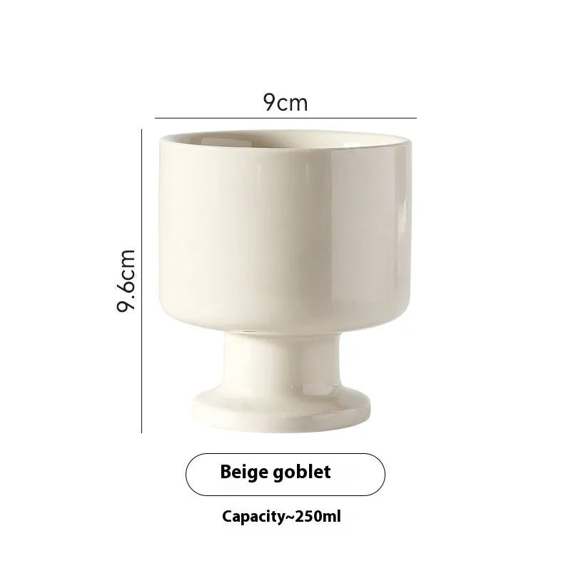 Hand-pinched irregular shaped ceramic mug in solid colour with modern simplicity design