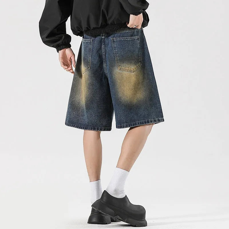 American High Street men's loose fit ripped jeans in retro blue denim showing distressed detail.
