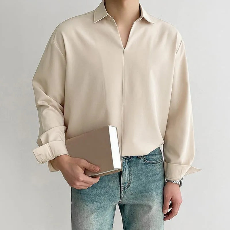 Men's loose lapel casual long sleeve shirt in solid colours on a hanger