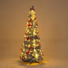 Green velvet foldable telescopic Christmas tree with warm lights on floor-standing base in indoor room setting