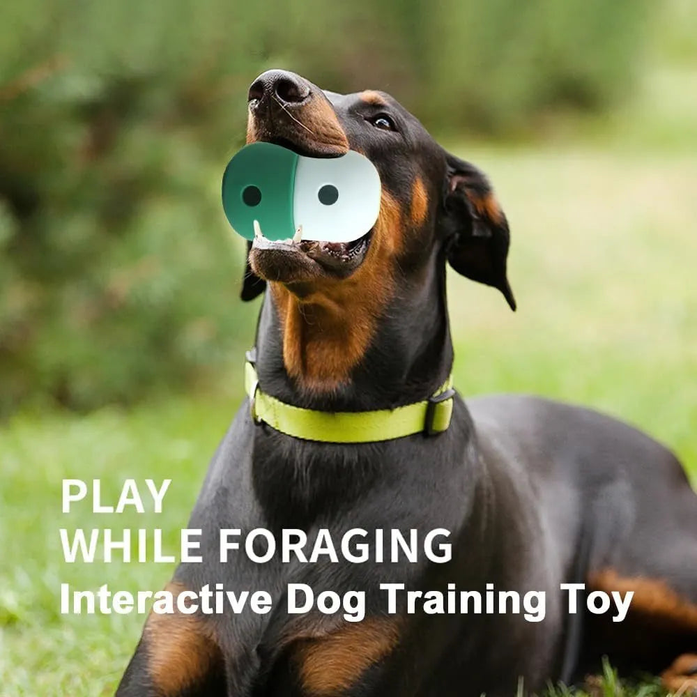 Two-tone silicone dog treat dispensing puzzle ball for small medium dogs on a wooden floor