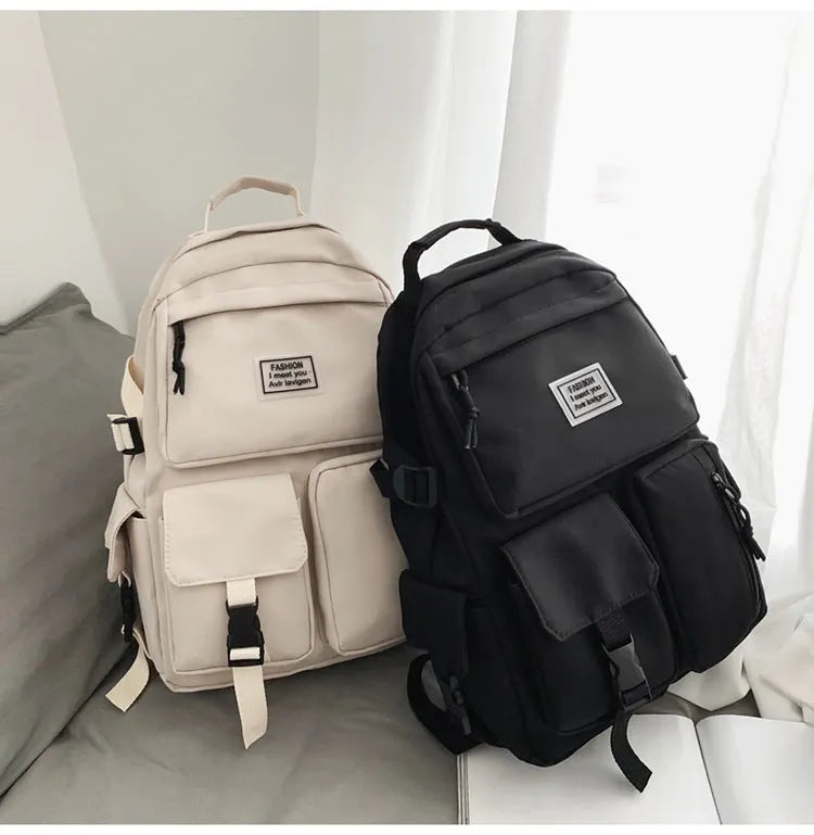 Black and white student backpack with computer compartment showing dimensions 31x12x41cm