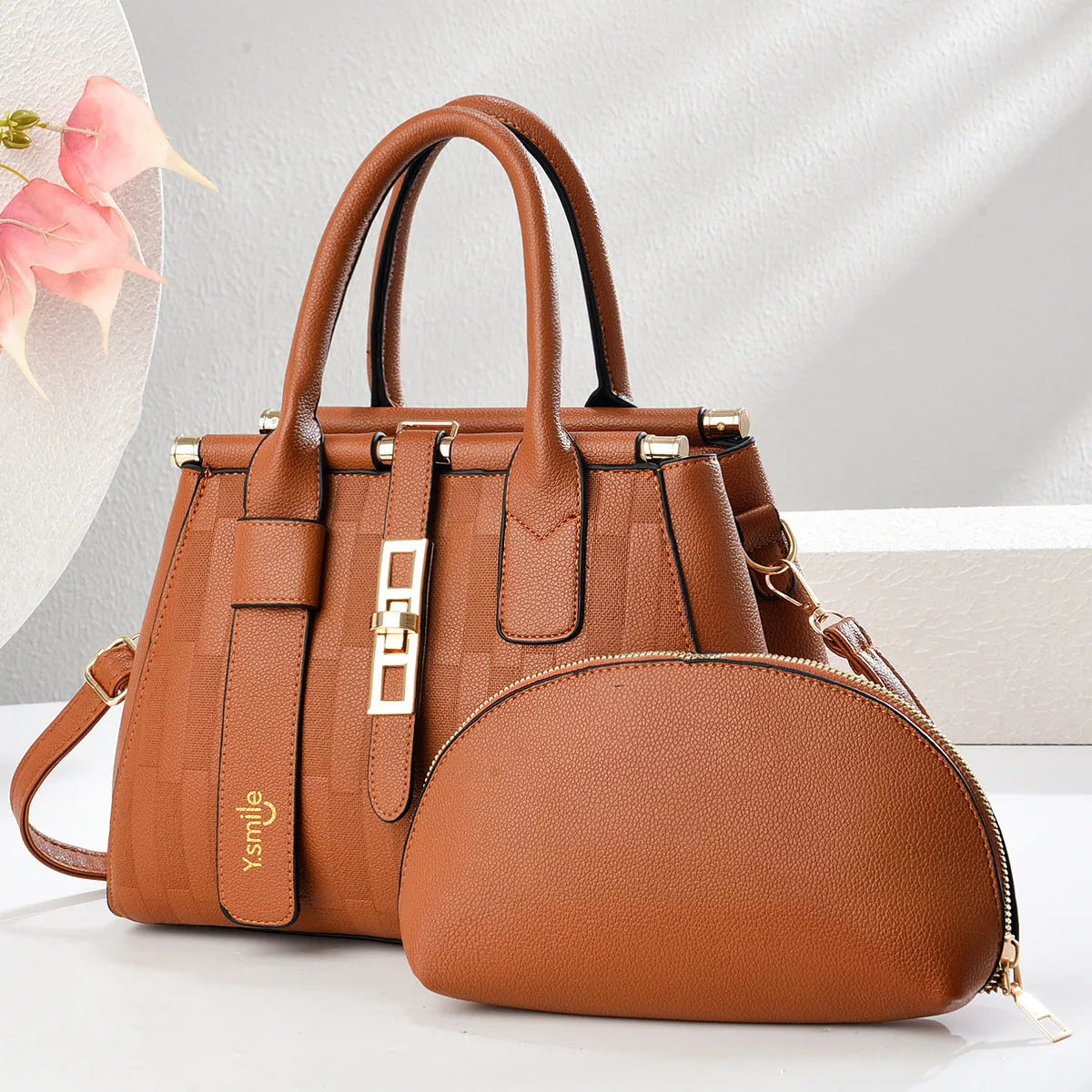 Round PU leather crossbody handbag in light khaki colour showing front view and adjustable shoulder strap.