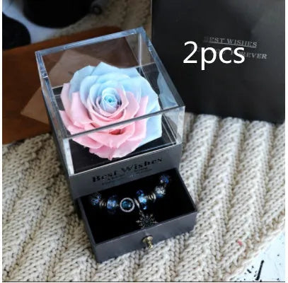 Eternal Flower gift box with preserved roses and carnations inside, measuring 8.5 cm square by 10.5 cm high