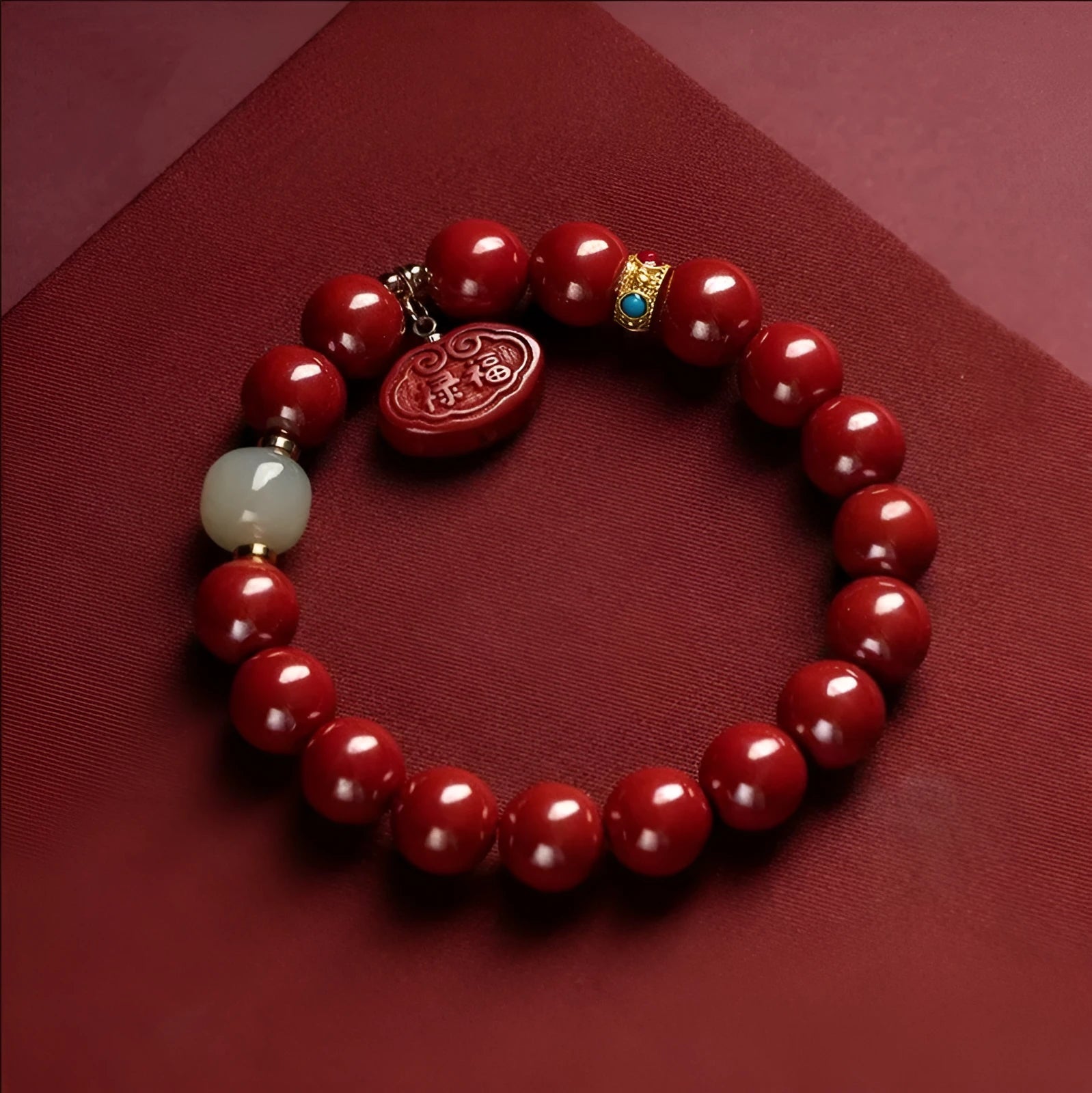 Natural cinnabar bracelet with Emperor sandstone design and Ping An Fu Lu motifs.