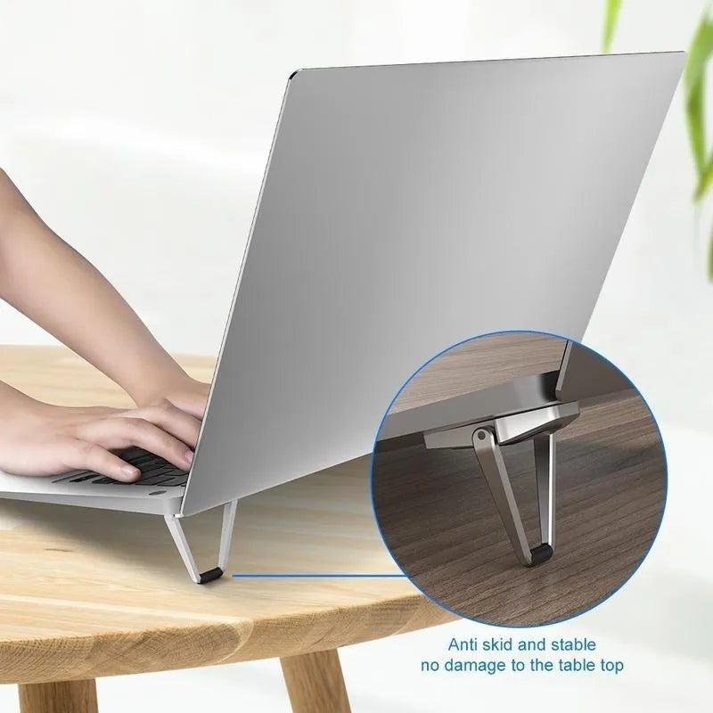 Aluminium alloy foldable laptop bracket showing compact folded size and silver colour