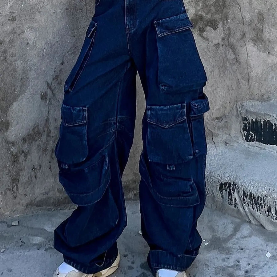 Dark blue wide-leg jeans with distressed detailing, high waist, and multiple pockets on mannequin