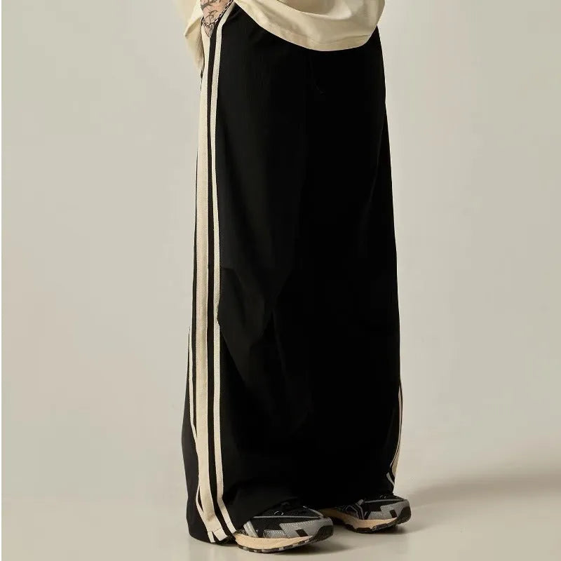 Men's black wide-leg climbing trousers with high waist and straight-leg design