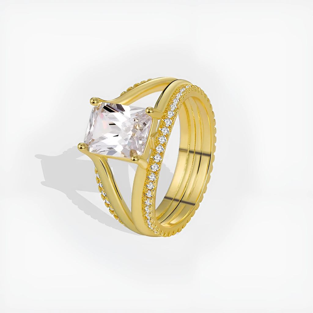 Gold colour geometric women's ring with a square zircon stone on a copper band.