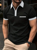 Man wearing a grey and navy blue casual t-shirt with a chest pocket and silver zip decoration detail.