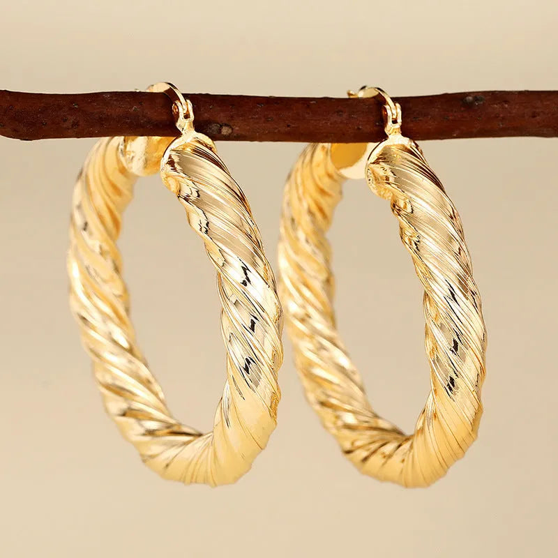 Copper geometric ring design ear clip earrings for women in assorted colours.