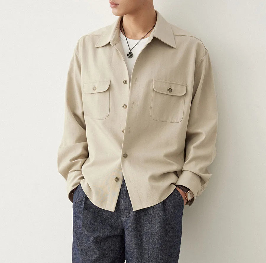Men's simple profile lapel shirt in light sand rice colour, showing long sleeves and front button placket.