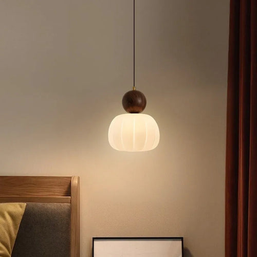 Nordic pumpkin-shaped alloy chandelier for ceiling mounting in a bedroom or dining room.